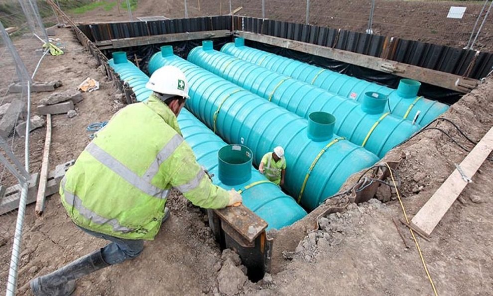 Petrol tank installation in a groundworks excavation using ground support equipment and steel sheet pile
